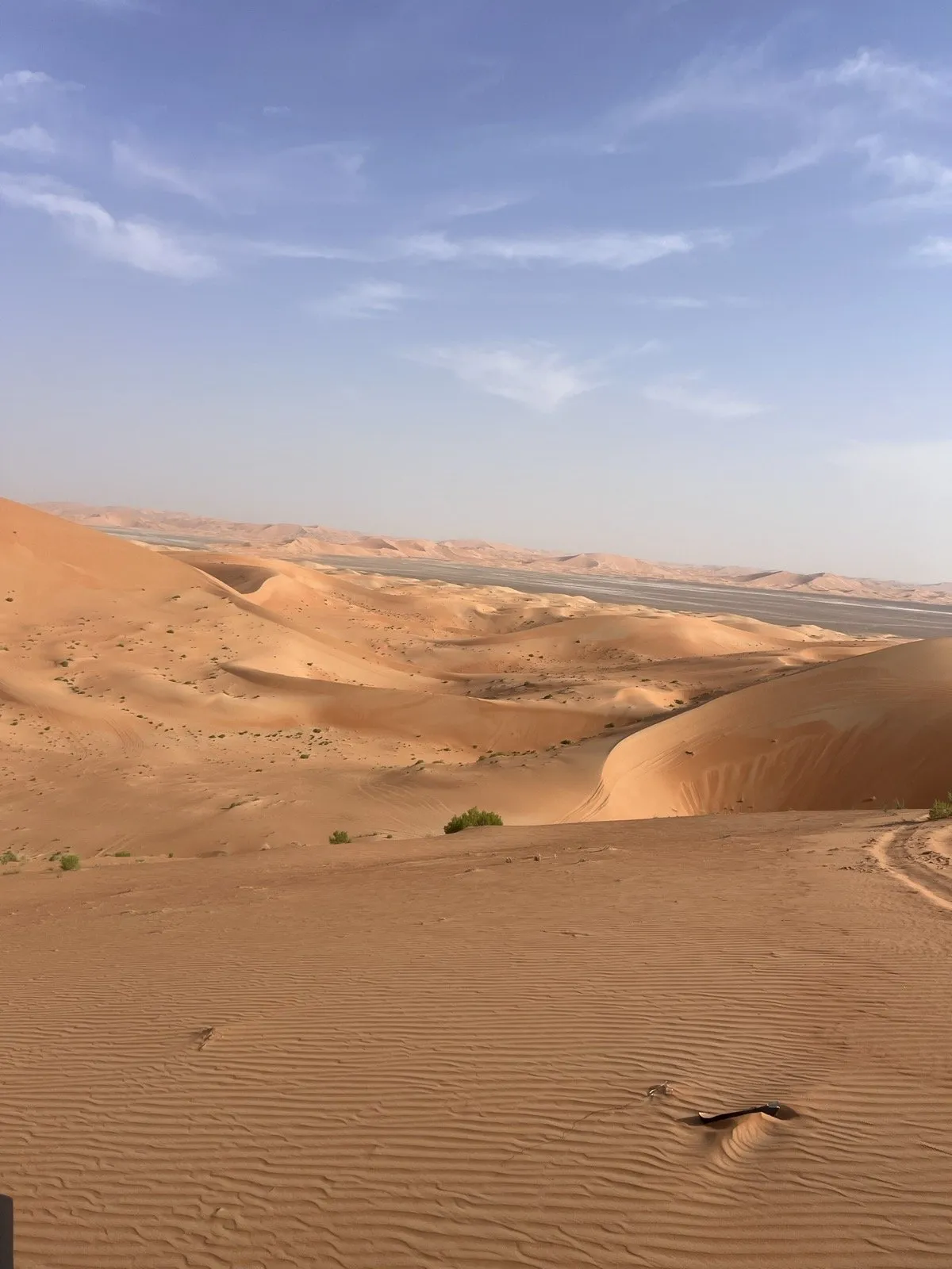 Empty rolling dunes at Al Quaa in the afternoon light, no other cars in sight